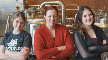 Women in front of brewing equipment